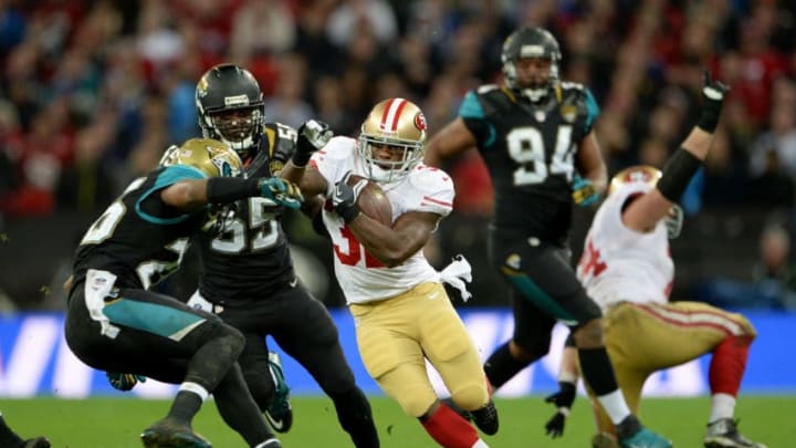 LONDON, ENGLAND - OCTOBER 27: #32 Kendall Hunter of the San Francisco 49ers attempts to break free during the NFL International Series game between San Francisco 49ers and Jacksonville Jaguars at Wembley Stadium on October 27, 2013 in London, England. (Photo by Michael Regan/Getty Images)