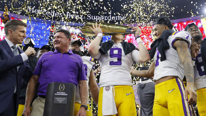 NEW ORLEANS, LOUISIANA – JANUARY 13: Head coach Ed Orgeron of the LSU Tigers, Joe Burrow #9 of the LSU Tigers and Grant Delpit #7 of the LSU Tigers celebrate with the trophy after defeating the Clemson Tigers 42-25 in the College Football Playoff National Championship game at Mercedes Benz Superdome on January 13, 2020 in New Orleans, Louisiana. Is he on his way to the Bengals? (Photo by Kevin C. Cox/Getty Images)