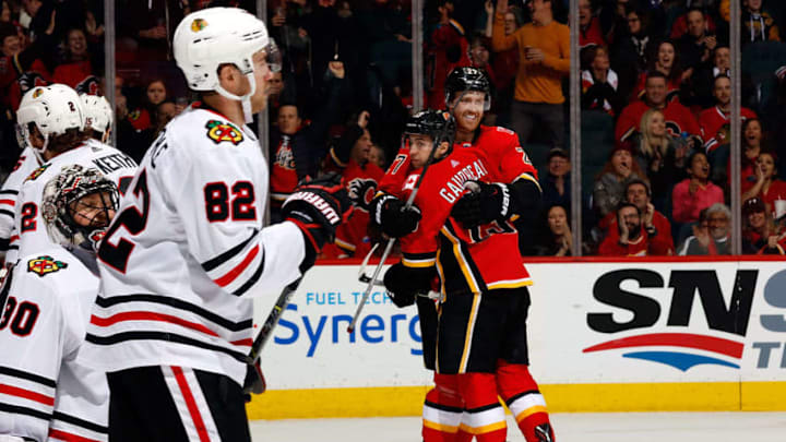 CALGARY, AB - FEBRUARY 3: Dougie Hamilton #27 and Johnny Gaudreau #13 of the Calgary Flames celebrate a goal against the Chicago Blackhawks the Chicago Blackhawks during an NHL game on February 3, 2018 at the Scotiabank Saddledome in Calgary, Alberta, Canada. (Photo by Gerry Thomas/NHLI via Getty Images)