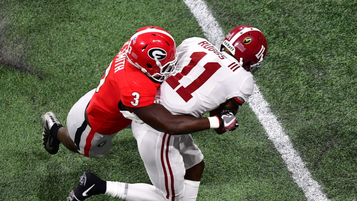 ATLANTA, GA – JANUARY 08: Henry Ruggs #11 of the Alabama Crimson Tide is tackled by Roquan Smith #3 of the Georgia Bulldogs in the CFP National Championship presented by AT&T at Mercedes-Benz Stadium on January 8, 2018 in Atlanta, Georgia. (Photo by Scott Cunningham/Getty Images)