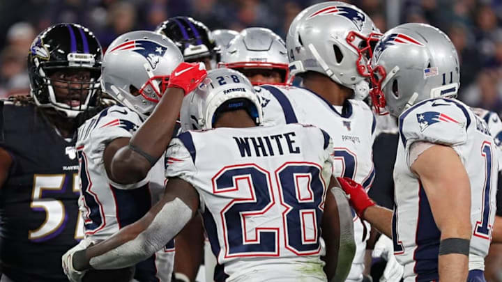 BALTIMORE, MARYLAND - NOVEMBER 03: Running back James White #28 of the New England Patriots scores and celebrates a third quarter touchdown against the Baltimore Ravens at M&T Bank Stadium on November 3, 2019 in Baltimore, Maryland. (Photo by Scott Taetsch/Getty Images)