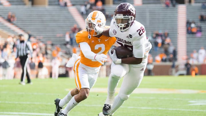 Tennessee defensive back Alontae Taylor (2) defends Texas A&M running back Isaiah Spiller (28) during a game between Tennessee and Texas A&M in Neyland Stadium in Knoxville, Saturday, Dec. 19, 2020.Bep 2383