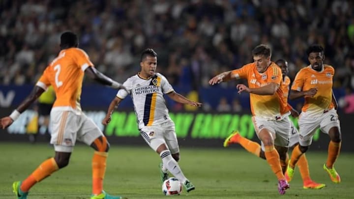 Jul 15, 2016; Carson, CA, USA; LA Galaxy forward Giovani dos Santos (10) dribbles the ball against the Houston Dynamo during a MLS soccer game at StubHub Center. The Galaxy defeated the Dynamo 1-0. Mandatory Credit: Kirby Lee-USA TODAY Sports