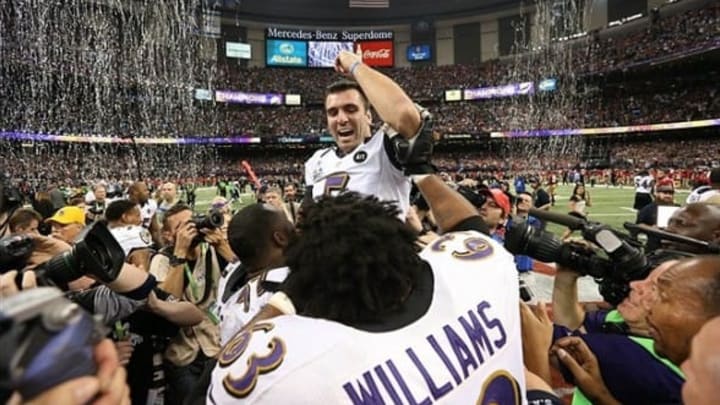 Feb 3, 2013; New Orleans, LA, USA; Baltimore Ravens quarterback Joe Flacco (5) celebrates with Bobbie Williams (63) after defeating the San Francisco 49ers 34-31 in Super Bowl XLVII at the Mercedes-Benz Superdome. Mandatory Credit: Matthew Emmons-USA TODAY Sports