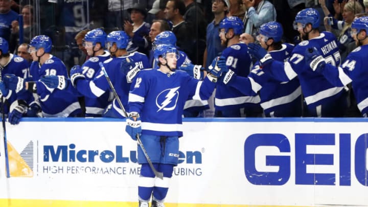 Oct 28, 2021; Tampa, Florida, USA; Tampa Bay Lightning center Alex Barré-Boulet (12) is congratulated after scoring a goal against the Arizona Coyotes during the second period at Amalie Arena. Mandatory Credit: Kim Klement-USA TODAY Sports