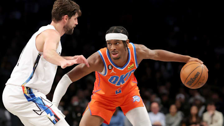 OKC Thunder guard Shai Gilgeous-Alexander (2) controls the ball against Brooklyn Nets forward Joe Harris (12): Brad Penner-USA TODAY Sports