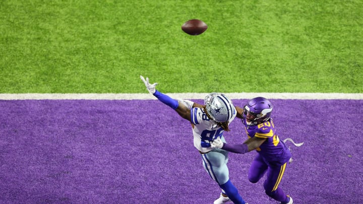 MINNEAPOLIS, MINNESOTA – NOVEMBER 22: CeeDee Lamb #88 of the Dallas Cowboys attempts to make a catch against Jeff Gladney #20 of the Minnesota Vikings during their game at U.S. Bank Stadium on November 22, 2020 in Minneapolis, Minnesota. (Photo by Adam Bettcher/Getty Images)