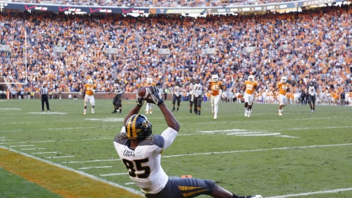 KNOXVILLE, TN - NOVEMBER 10: Marcus Lucas #85 of the Missouri Tigers catches an 18-yard touchdown pass in the second overtime against the Tennessee Volunteers during the game at Neyland Stadium on November 10, 2012 in Knoxville, Tennessee. Missouri won 51-48 in four overtimes. (Photo by Joe Robbins/Getty Images)