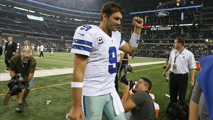 Sep 8, 2013; Arlington, TX, USA; Dallas Cowboys quarterback Tony Romo (9) pumps his fist on his way to the locker room after the game against the New York Giants at AT