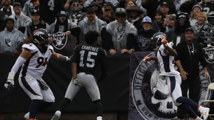 OAKLAND, CA - NOVEMBER 26: Michael Crabtree No. 15 of the Oakland Raiders fights with Aqib Talib No. 21 of the Denver Broncos during the first quarter their NFL football game at Oakland-Alameda County Coliseum on November 26, 2017 in Oakland, California. Both Crabtree and Talib were disqualified after the incident(Photo by Stephen Lam/Getty Images)