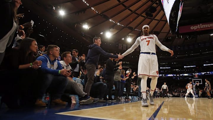 Dec 20, 2016; New York, NY, USA; New York Knicks forward Carmelo Anthony (7) celebrates with fans late in the fourth quarter of a win over the Indiana Pacers at Madison Square Garden. Mandatory Credit: Adam Hunger-USA TODAY Sports