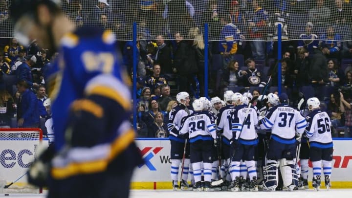 Dec 3, 2016; St. Louis, MO, USA; Winnipeg Jets center Bryan Little (not pictured) celebrates with teammates after scoring the game winning goal in overtime as St. Louis Blues defenseman Alex Pietrangelo (27) skates off the ice at Scottrade Center. The Jets won 3-2 in overtime. Mandatory Credit: Jeff Curry-USA TODAY Sports