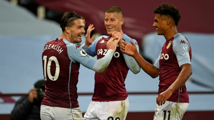 Aston Villa’s English midfielder Jack Grealish (L) celebrates with Aston Villa’s English midfielder Ross Barkley (C) and Aston Villa’s English striker Ollie Watkins (R) after scoring their seventh goal during the English Premier League football match between Aston Villa and Liverpool at Villa Park in Birmingham, central England on October 4, 2020. (Photo by PETER POWELL / POOL / AFP) / RESTRICTED TO EDITORIAL USE. No use with unauthorized audio, video, data, fixture lists, club/league logos or ‘live’ services. Online in-match use limited to 120 images. An additional 40 images may be used in extra time. No video emulation. Social media in-match use limited to 120 images. An additional 40 images may be used in extra time. No use in betting publications, games or single club/league/player publications. / (Photo by PETER POWELL/POOL/AFP via Getty Images)