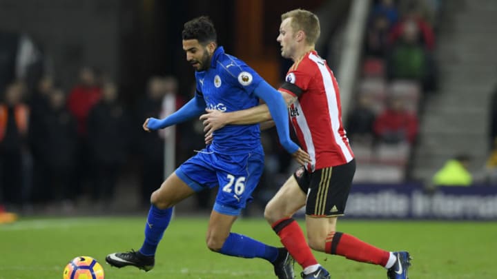 SUNDERLAND, ENGLAND - DECEMBER 03: Riyad Mahrez of Leicester City holds off Sebastian Larsson of Sunderland during the Premier League match between Sunderland and Leicester City at Stadium of Light on December 3, 2016 in Sunderland, England. (Photo by Stu Forster/Getty Images)