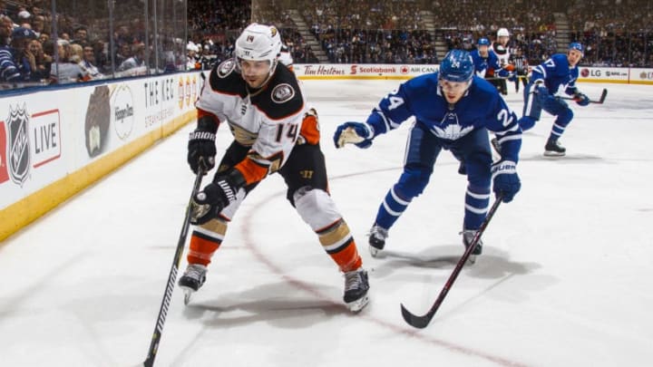 TORONTO, ON - FEBRUARY 05: Adam Henrique #14 of the Anaheim Ducks skates against Kasperi Kapanen #24 of the Toronto Maple Leafs during the first period at the Air Canada Centre on February 5, 2018 in Toronto, Ontario, Canada. (Photo by Mark Blinch/NHLI via Getty Images)