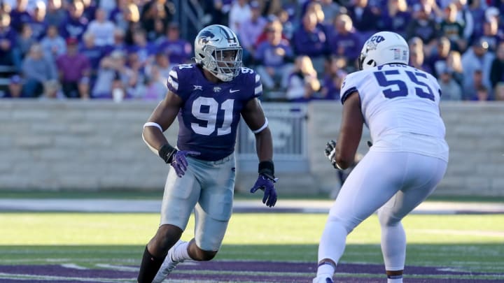Oct 30, 2021; Manhattan, Kansas, USA; Kansas State Wildcats defensive end Felix Anudike-Uzomah (91) rushes the passer against TCU Horned Frogs offensive tackle Obinna Eze (55) during the third quarter at Bill Snyder Family Football Stadium. Anudike-Uzomah had six sacks in the game. Mandatory Credit: Scott Sewell-USA TODAY Sports