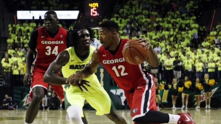 Jan 30, 2016; Waco, TX, USA; Georgia Bulldogs guard Kenny Gaines (12) dribbles on Baylor Bears forward Taurean Prince (21) during the first half at Ferrell Center. Mandatory Credit: Ray Carlin-USA TODAY Sports