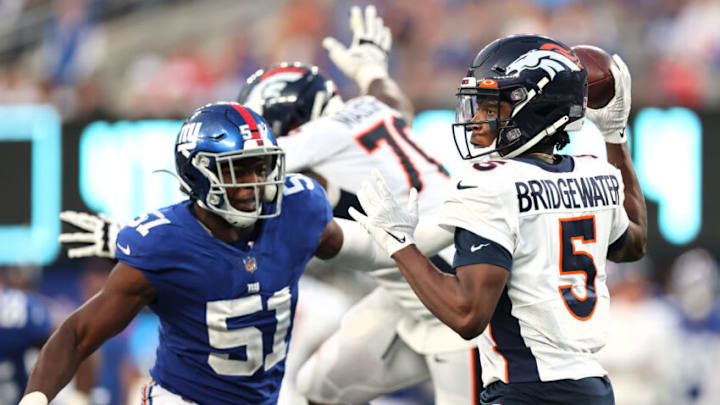 EAST RUTHERFORD, NEW JERSEY - SEPTEMBER 12: Teddy Bridgewater #5 of the Denver Broncos looks to pass against Azeez Ojulari #51 of the New York Giants during the fourth quarter at MetLife Stadium on September 12, 2021 in East Rutherford, New Jersey. (Photo by Alex Trautwig/Getty Images)
