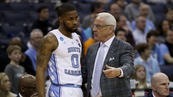 COLUMBUS, OHIO - MARCH 22: Head coach Roy Williams of the North Carolina Tar Heels talks with Seventh Woods #0 of the North Carolina Tar Heels as they take on the Iona Gaels during the second half of the game in the first round of the 2019 NCAA Men's Basketball Tournament at Nationwide Arena on March 22, 2019 in Columbus, Ohio. The North Carolina Tar Heels won 88-73. (Photo by Gregory Shamus/Getty Images)
