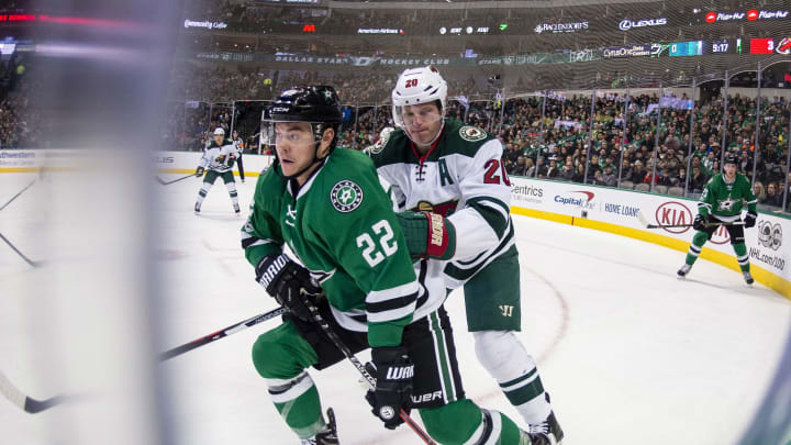 Jan 14, 2017; Dallas, TX, USA; Dallas Stars left wing Jiri Hudler (22) and Minnesota Wild defenseman Ryan Suter (20) chase the puck during the first period at the American Airlines Center. Mandatory Credit: Jerome Miron-USA TODAY Sports