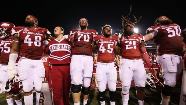 Oct 15, 2016; Fayetteville, AR, USA; Arkansas Razorbacks offensive lineman Dan Skipper (70) celebrates with teammates after the game against the Ole Miss Rebels at Donald W. Reynolds Razorback Stadium. Arkansas defeated Ole Miss 34-30. Mandatory Credit: Nelson Chenault-USA TODAY Sports