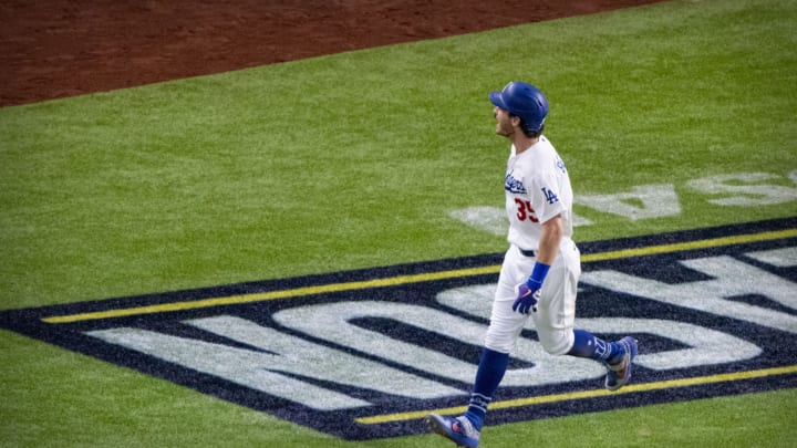 Oct 18, 2020; Arlington, Texas, USA; Los Angeles Dodgers center fielder Cody Bellinger (35) rounds the bases and celebrates hitting a home run against the Atlanta Braves during the seventh inning in game seven of the 2020 NLCS at Globe Life Field. Mandatory Credit: Jerome Miron-USA TODAY Sports