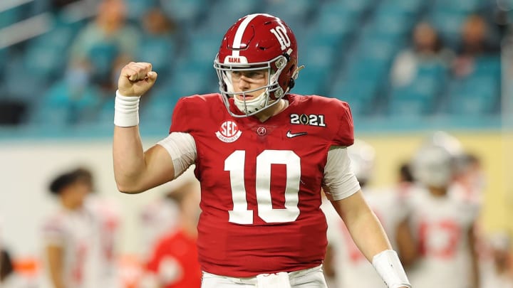 MIAMI GARDENS, FLORIDA – JANUARY 11: Mac Jones #10 of the Alabama Crimson Tide reacts to a touchdown during the second quarter of the College Football Playoff National Championship game against the Ohio State Buckeyes at Hard Rock Stadium on January 11, 2021 in Miami Gardens, Florida. (Photo by Kevin C. Cox/Getty Images)