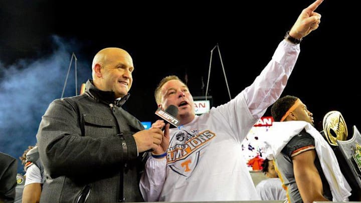 Dec 30, 2016; Nashville , TN, USA; Tennessee Volunteers head coach Butch Jones (R) speaks to the fans after defeated the Nebraska Cornhuskers 38-24 at Nissan Stadium. Mandatory Credit: Jim Brown-USA TODAY Sports