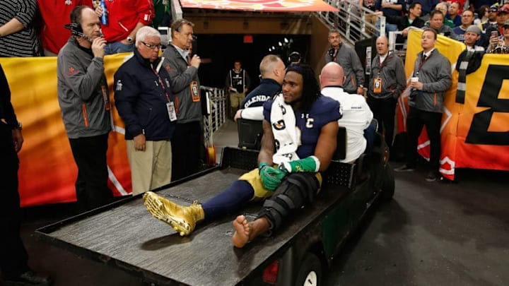 GLENDALE, AZ - JANUARY 01: Linebacker Jaylon Smith #9 of the Notre Dame Fighting Irish is carted off the field after an injury during the first quarter of the BattleFrog Fiesta Bowl against the Ohio State Buckeyes at University of Phoenix Stadium on January 1, 2016 in Glendale, Arizona. (Photo by Christian Petersen/Getty Images)