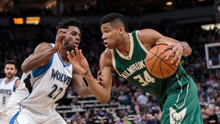 Dec 30, 2016; Minneapolis, MN, USA; Milwaukee Bucks forward Giannis Antetokounmpo (34) dribbles the ball as Minnesota Timberwolves guard Andrew Wiggins (22) defends in the second quarter against at Target Center. Mandatory Credit: Brad Rempel-USA TODAY Sports