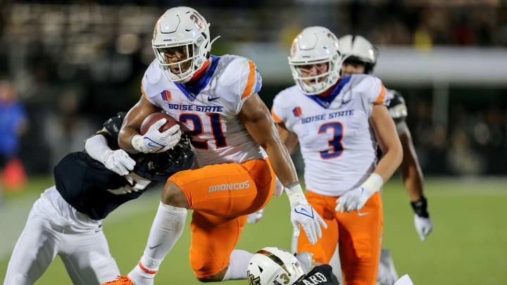 ORLANDO, FL – SEPTEMBER 02: Andrew Van Buren #21 of the Boise State Broncos runs past Davonte Brown #7 of the UCF Knights and Quadric Bullard #37 of the UCF Knights at the Bounce House on September 2, 2021 in Orlando, Florida. (Photo by Alex Menendez/Getty Images)