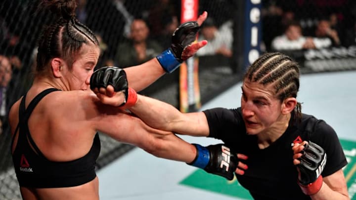 LAS VEGAS, NEVADA - JANUARY 18: (R-L) Roxanne Modafferi punches Maycee Barber in their flyweight fight during the UFC 246 event at T-Mobile Arena on January 18, 2020 in Las Vegas, Nevada. (Photo by Jeff Bottari/Zuffa LLC via Getty Images)