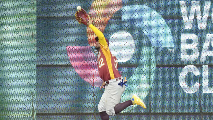 MIAMI, FLORIDA - MARCH 12: Ronald Acuna Jr. #42 of Venezuela makes a running catch to end the game against Puerto Rico at loanDepot park on March 12, 2023 in Miami, Florida. (Photo by Eric Espada/Getty Images)