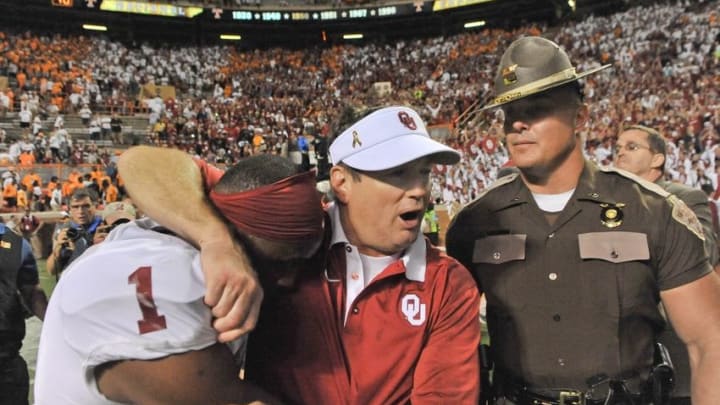Sep 12, 2015; Knoxville, TN, USA; Oklahoma Sooners head coach Bob Stoops celebrates with wide receiver Jarvis Baxter (1) after defeating the Tennessee Volunteers in double overtime at Neyland Stadium. Oklahoma won 31-24. Mandatory Credit: Jim Brown-USA TODAY Sports