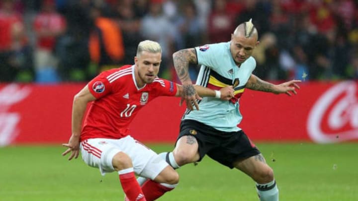 LILLE, FRANCE - JULY 01: Aaron Ramsey of Wales in action with Radja Nainggolan of Belgium during the UEFA Euro 2016 Quarter Final match between Wales and Belgium at Stade Pierre-Mauroy on July 1, 2016 in Lille, France. (Photo by Chris Brunskill Ltd/Getty Images)