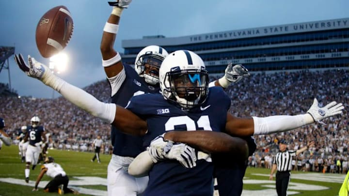 STATE COLLEGE, PA - SEPTEMBER 01: Amani Oruwariye #21 of the Penn State Nittany Lions celebrates after intercepting a pass in overtime to clinch the win against the Appalachian State Mountaineers on September 1, 2018 at Beaver Stadium in State College, Pennsylvania. (Photo by Justin K. Aller/Getty Images)