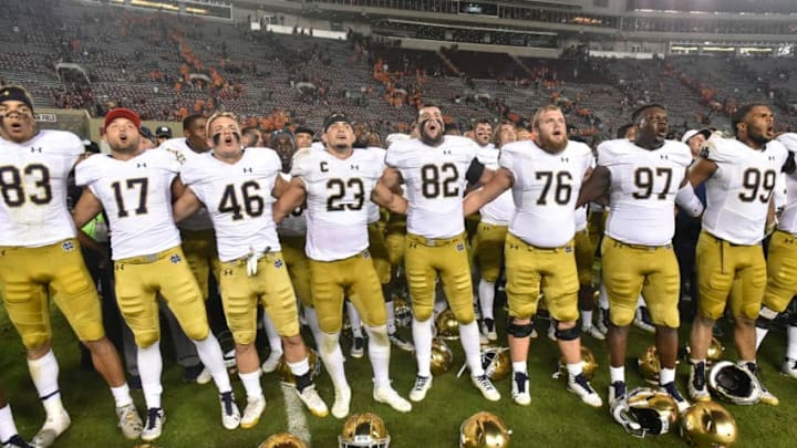 BLACKSBURG, VA - OCTOBER 6: Members of the Notre Dame Fighting Irish sing the fight song following the victory against the Virginia Tech Hokies at Lane Stadium on October 6, 2018 in Blacksburg, Virginia. (Photo by Michael Shroyer/Getty Images)