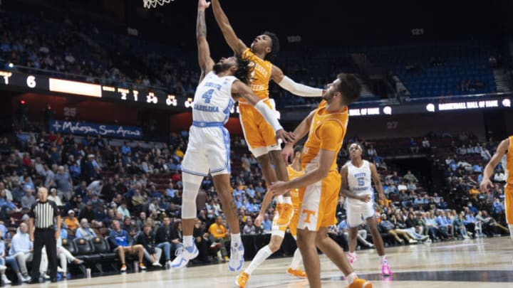 Nov 21, 2021; Uncasville, CT, USA; Tennessee Volunteers guard Kennedy Chandler (1) blocks a shot attempt by North Carolina Tarheels guard RJ Davis (4) during the first half at Mohegan Sun Arena. Mandatory Credit: Gregory Fisher-USA TODAY Sports