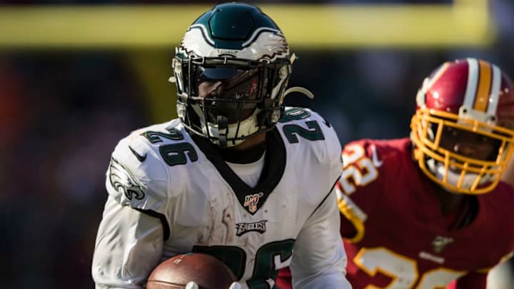 LANDOVER, MD - DECEMBER 15: Miles Sanders #26 of the Philadelphia Eagles carries the ball as Jimmy Moreland #32 of the Washington Redskins defends during the first half at FedExField on December 15, 2019 in Landover, Maryland. (Photo by Scott Taetsch/Getty Images)