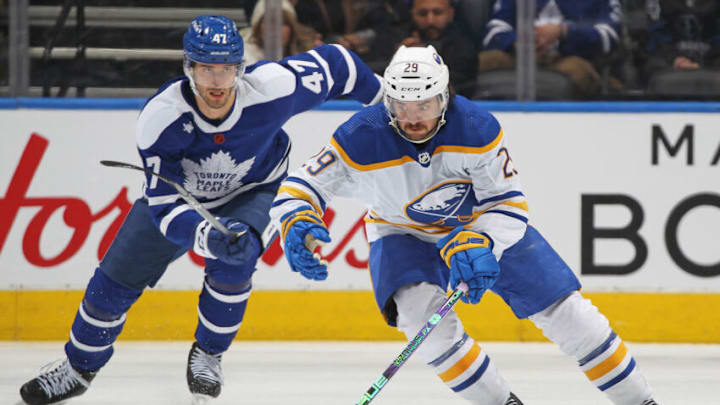 TORONTO, CANADA - NOVEMBER 19: Vinnie Hinosttoza #29 of the Buffalo Sabres skates with the puck against Pierre Engvall #47 of the Toronto Maple Leafs during an NHL game at Scotiabank Arena on November 19, 2022 in Toronto, Ontario, Canada. The Maple Leafs defeated the Sabres 5-2. (Photo by Claus Andersen/Getty Images)