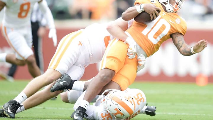 Tennessee running back Fred Orr (40) is tackled at the Orange & White spring game at Neyland Stadium in Knoxville, Tenn. on Saturday, April 24, 2021.Kns Vols Spring Game