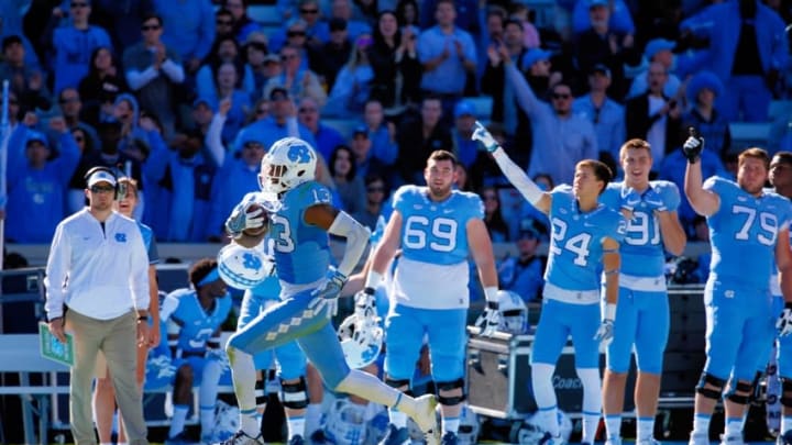 Nov 5, 2016; Chapel Hill, NC, USA; North Carolina Tar Heels wide receiver Bug Howard (13) runs down the sideline after his touchdown catch against the Georgia Tech Yellow Jackets during the second quarter at Kenan Memorial Stadium. Mandatory Credit: James Guillory-USA TODAY Sports