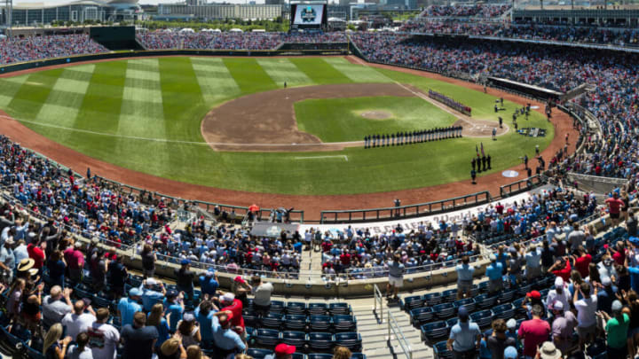 OMAHA, NE - JUNE 26: (EDITORS NOTES: This is a panoramic stitched from separate photos) The Ole Miss Rebels and Oklahoma Sooners stand for the National Anthem prior to the start of the Division I Men's Baseball Championship held at Charles Schwab Field on June 26, 2022 in Omaha, Nebraska. (Photo by Chris Gjevre/Blakeway World Panoramas/Getty Images)