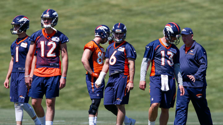 Jun 13, 2017; Englewood, CO, USA; Denver Broncos quarterbacks Kyle Sloter (1) and quarterback Paxton Lynch (12) and Chad Kelly (6) and Trevor Siemian (13) with quarterbacks coach Bill Musgrave and tight end Jake Butt (80) during minicamp at UCHealth Training Center. Mandatory Credit: Isaiah J. Downing-USA TODAY Sports