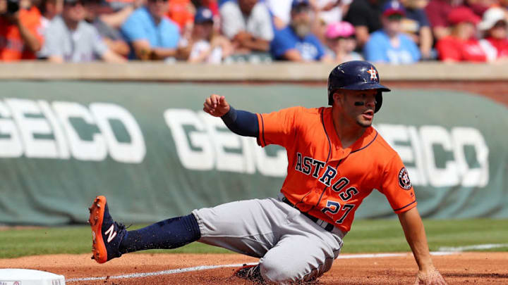 FanDuel MLB: ARLINGTON, TX - MARCH 31: Jose Altuve #27 of the Houston Astros slides into third on a single by Carlos Correa #1 of the Houston Astros in the first inning of a baseball game at Globe Life Park in Arlington on March 31, 2018 in Arlington, Texas. (Photo by Richard Rodriguez/Getty Images)
