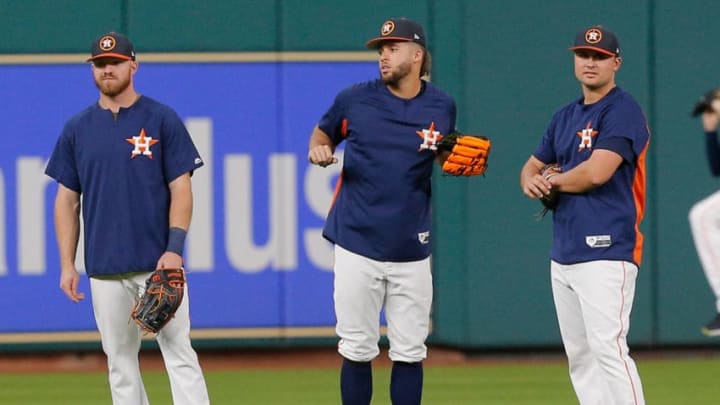HOUSTON, TX - AUGUST 18: Springer, Fisher, and Davis of the Houston Astros (Photo by Bob Levey/Getty Images)