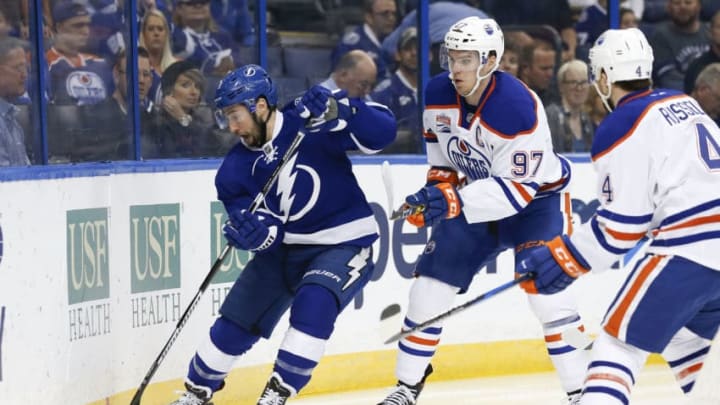 ST. PETERSBURG, FL - FEBRUARY 21: Tampa Bay Lightning center Tyler Johnson (9) and Edmonton Oilers center Connor McDavid (97) battle for the puck in the first period of the NHL game between the Edmonton Oilers and Tampa Bay Lightning on February 21, 2017, at Amalie Arena in Tampa, FL. (Photo by Mark LoMoglio/Icon Sportswire via Getty Images)