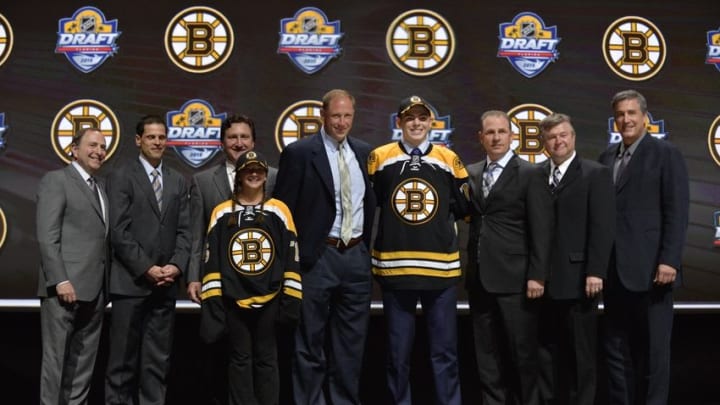 Jun 26, 2015; Sunrise, FL, USA; Jake Debrusk poses with team executives after being selected as the number fourteen overall pick to the Boston Bruins in the first round of the 2015 NHL Draft at BB&T Center. Mandatory Credit: Steve Mitchell-USA TODAY Sports