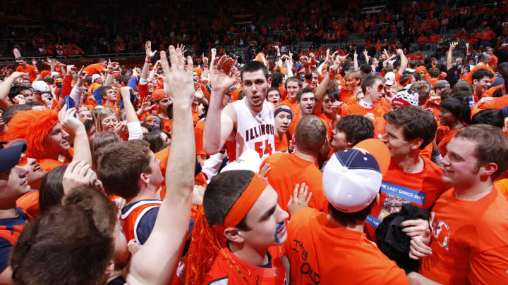 CHAMPAIGN, IL – FEBRUARY 6: Mike Tisdale #54 of the Illinois Fighting Illini celebrates with fans on the floor following the game against the Michigan State Spartans at Assembly Hall on February 6, 2010 in Champaign, Illinois. Illinois defeated Michigan State 78-73. (Photo by Joe Robbins/Getty Images)