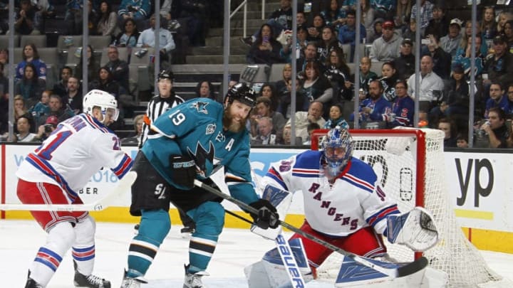 SAN JOSE, CA - MARCH 19: Joe Thornton #19 of the San Jose Sharks spots the puck in front of the net of the New York Rangers during a NHL game at the SAP Center at San Jose on March 19, 2016 in San Jose, California. (Photo by Nick Lust/NHLI via Getty Images)